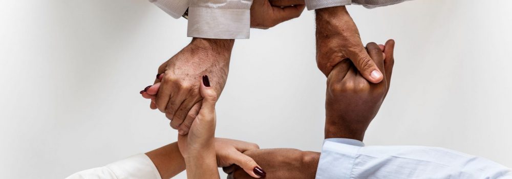Business-hands-joined-together-teamwork